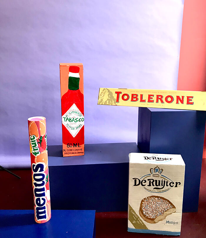 Studio photo of painted cardboard boxes ressembling grocery items